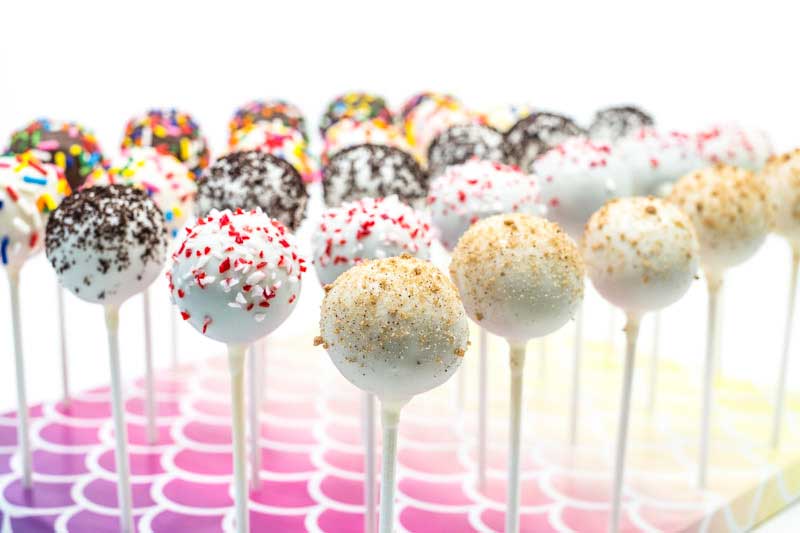 Assorted cake pop flavors in a stand