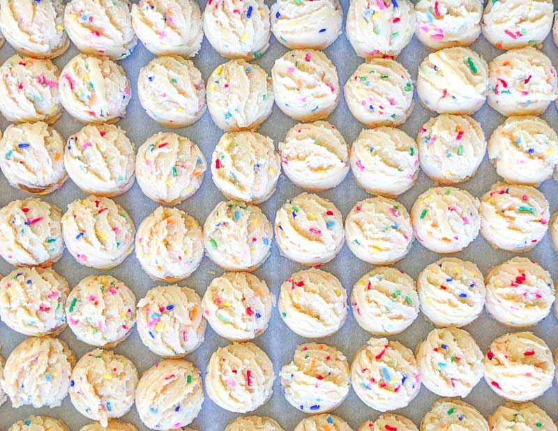 Cake pop balls on a tray after being scooped with a cookie scoop