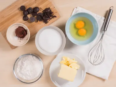 Cocoa powder, butter, sugar, eggs and chocolate melting wafers